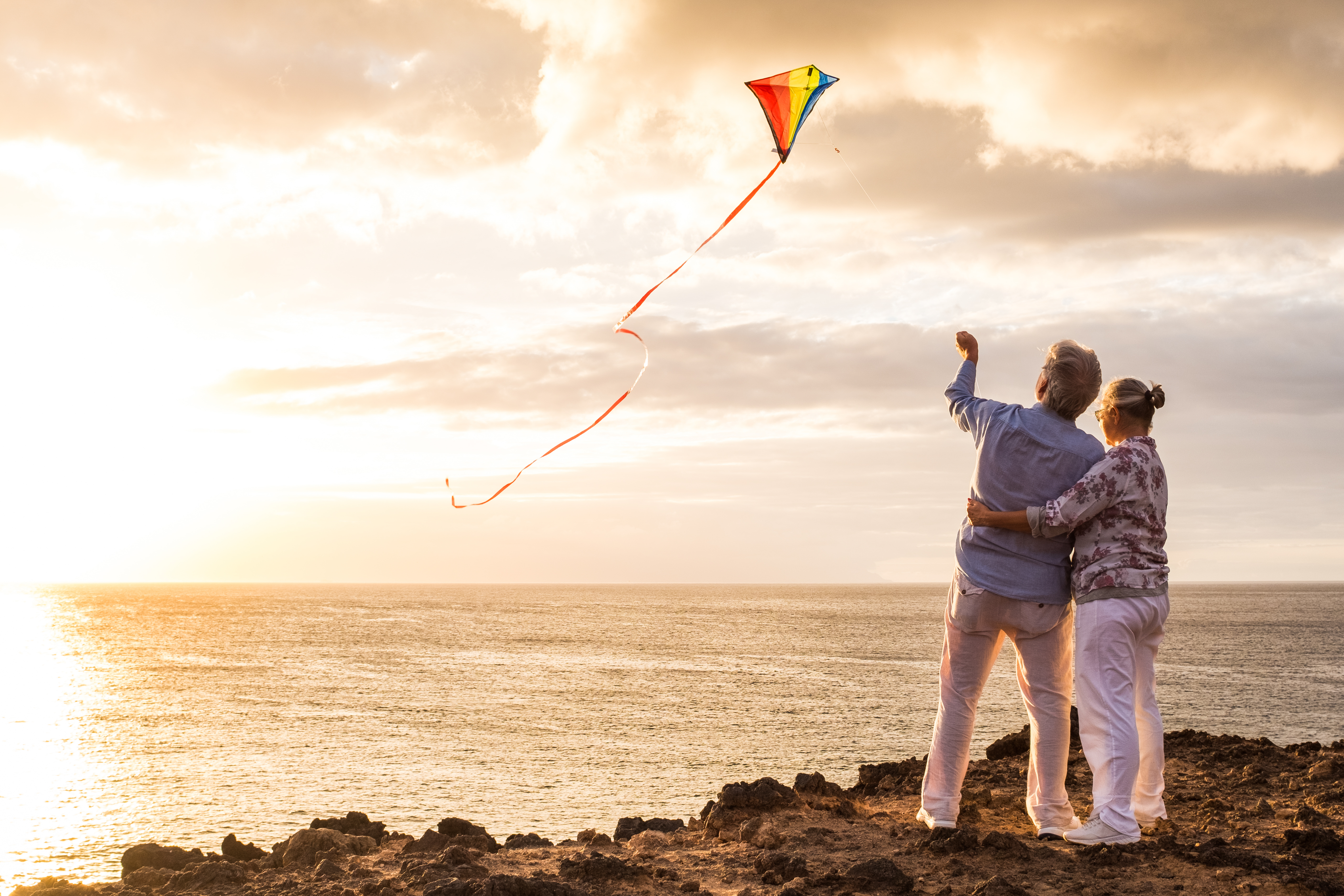 Two people flying a kite. One of the many things to do in Lincoln City.