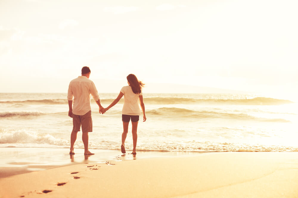 Photo of a Couple Holding Hands on the Beach, One of the Best Things to Do in Lincoln City, Oregon.